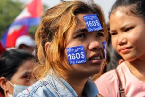 An apparel worker in Cambodia protests for a minimum living wage