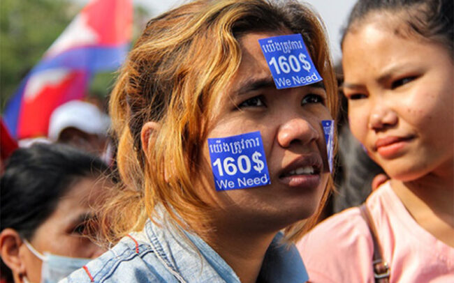 licadhoblog Transnational organizing in global supply chains: An apparel worker in Cambodia protests for a minimum living wage.